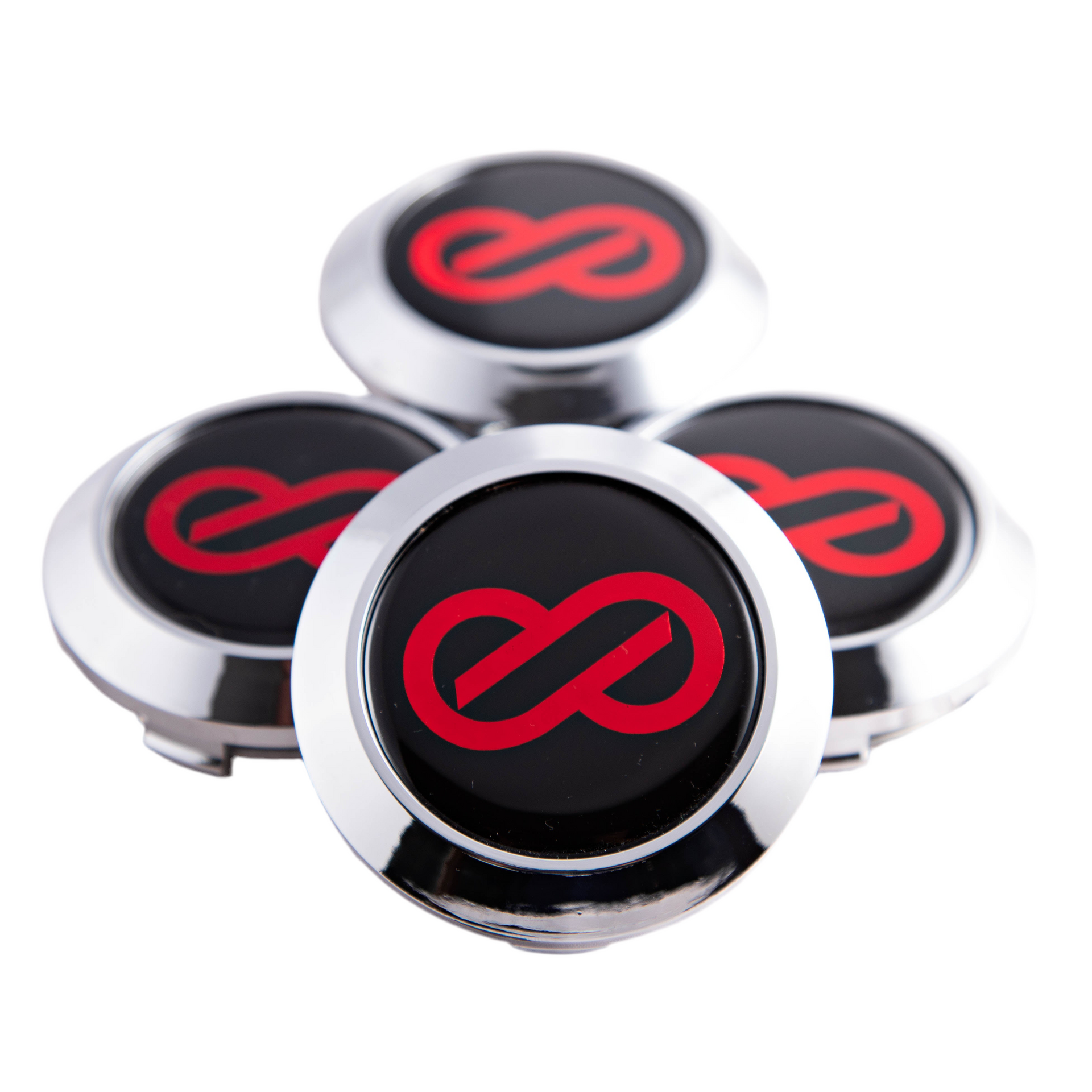 A set of four black ENKEI RPF1 center caps with a red logo on each.