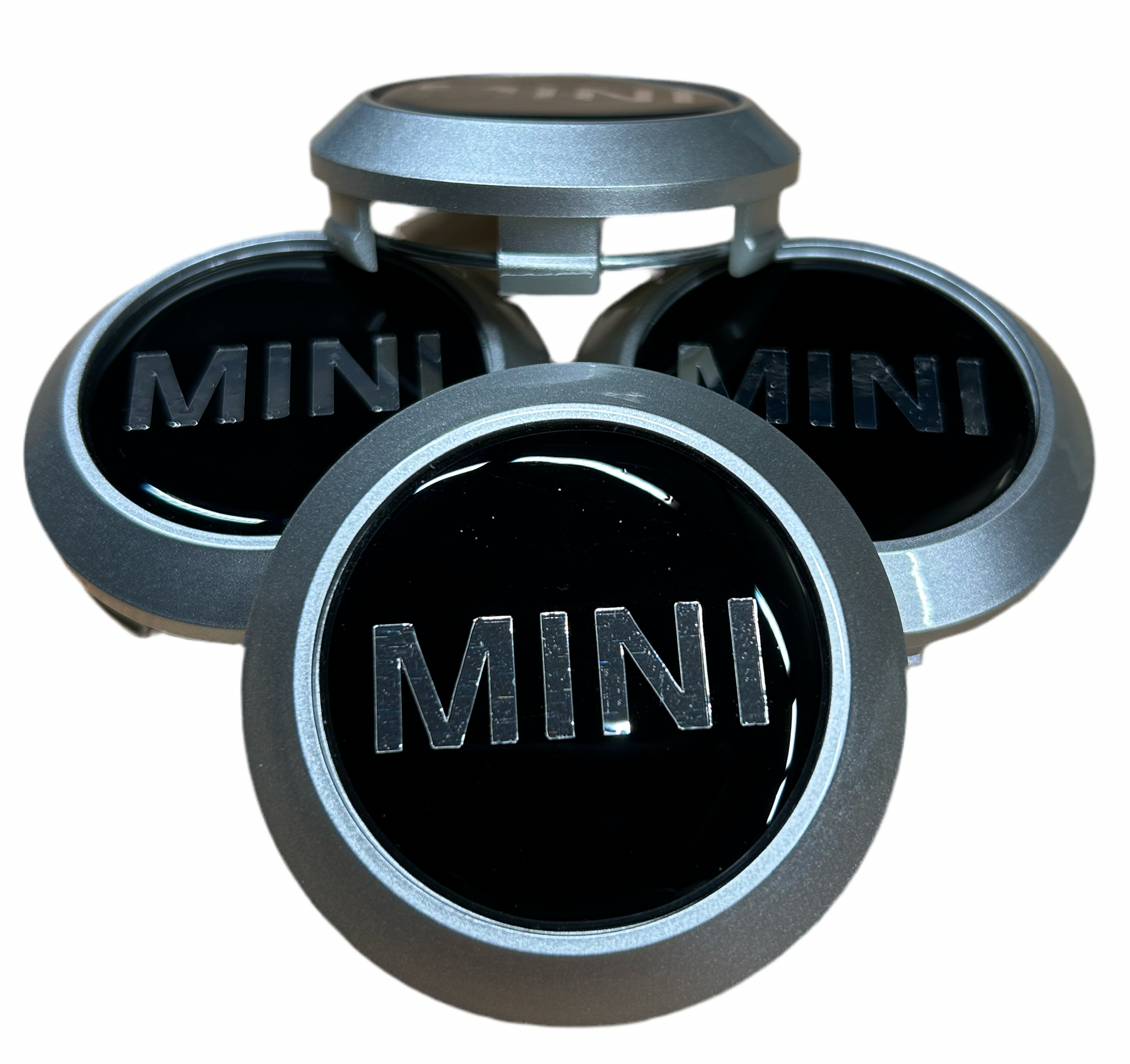 Set of MINI car hubcaps on a white background